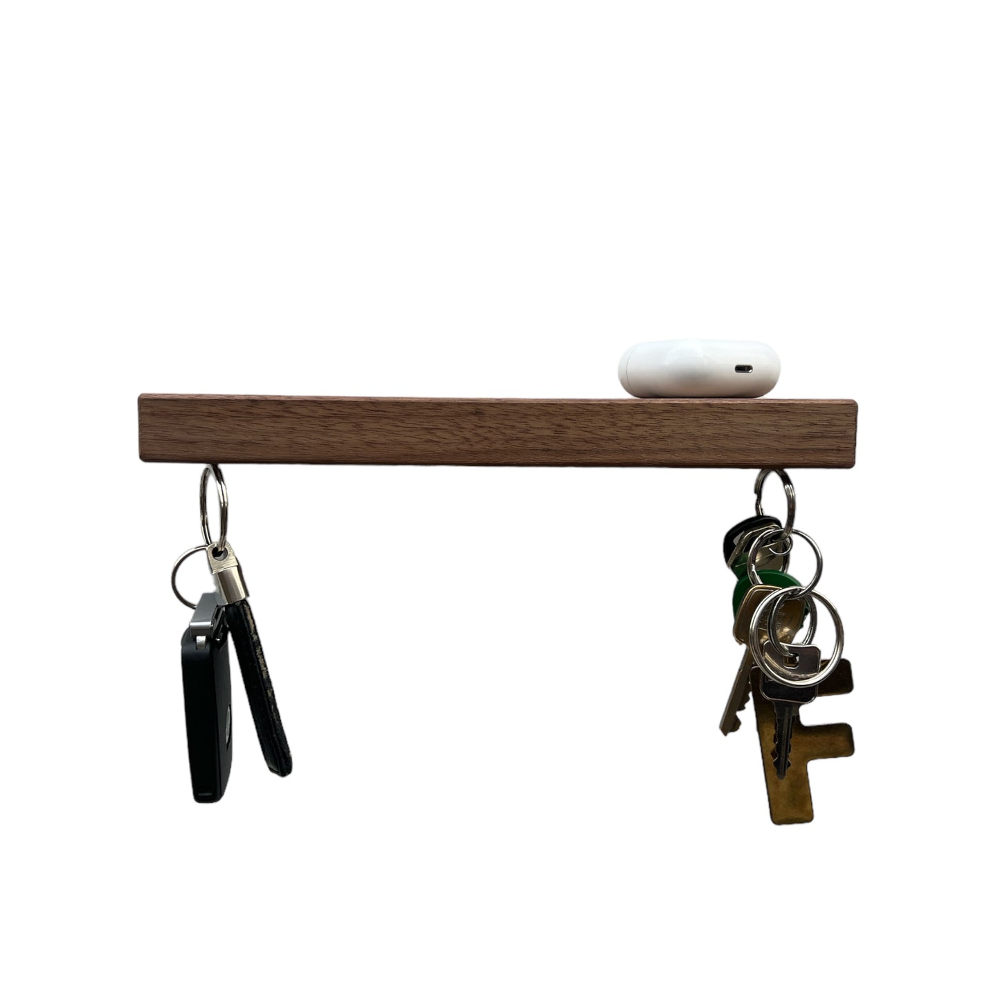 Sleutelplank, sleutelrek, sleutelrekje, sleutelhouder van massief notenhout. Voorzien van 5 supersterke magneten. HangKey Plankie X notenhout vooraanzicht